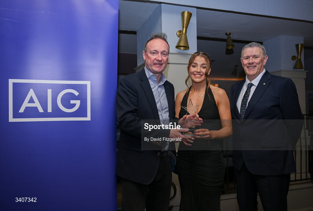 27 March 2026; Cara King of ATU Sligo is presented with her 2026 AIG HEC All Star award by Seán Fleming, Chairperson Ladies HEC and John Gillick, Head of Consumer Marketing and Sponsorship, AIG Ireland, at the 2026 AIG HEC All-Stars and Rising Stars evening, at the Dublin Bonnington Hotel. Photo by David Fitzgerald/Sportsfile