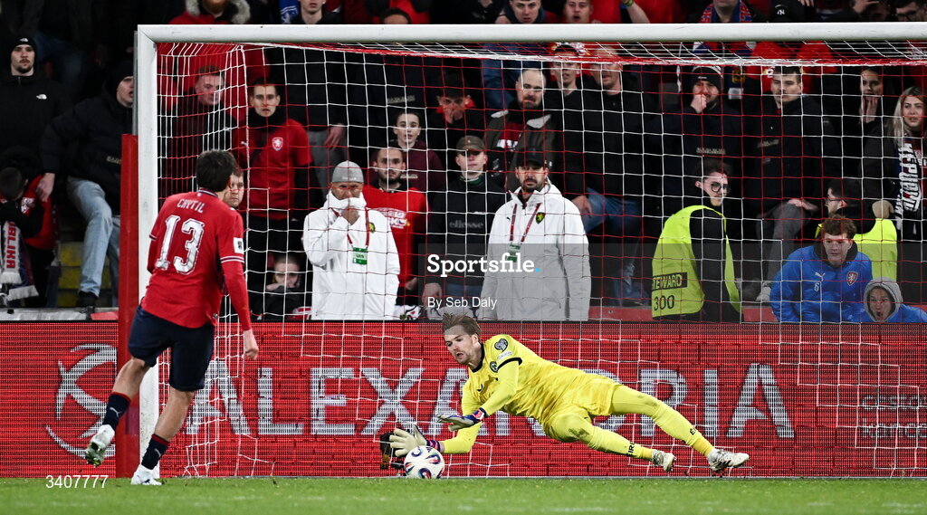 26 March 2026; Republic of Ireland goalkeeper Caoimhin Kelleher saves a penalty, from Czechia's Mojmír Chytil, in the penalty shootout during the FIFA World Cup 2026 European Qualifiers play-off semi-final match between Czechia and Republic of Ireland at Fortuna Arena in Prague, Czechia. Photo by Seb Daly/Sportsfile