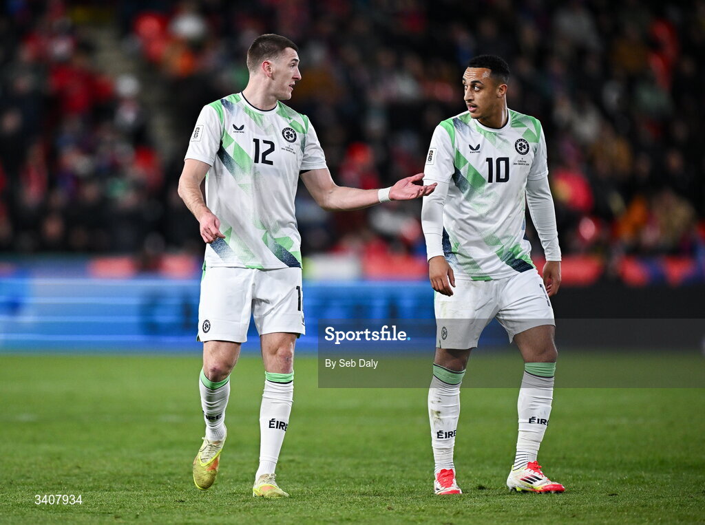 26 March 2026; Republic of Ireland players Jimmy Dunne, left, and Adam Idah during the FIFA World Cup 2026 European Qualifiers play-off semi-final match between Czechia and Republic of Ireland at Fortuna Arena in Prague, Czechia. Photo by Seb Daly/Sportsfile