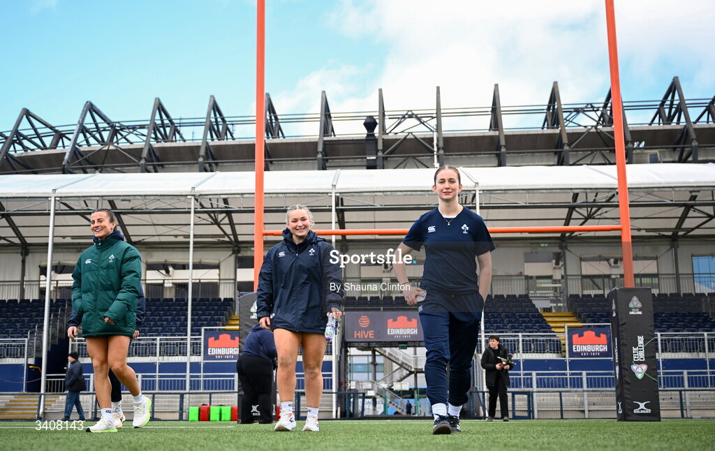 28 March 2026; Clovers players, from left, Emily Lane, Sadhbh McGrath and Ellie O'Sullivan-Sexton walk the pitch ahead of the Celtic Challenge final match between Wolfhounds and Clovers at The Hive Stadium in Edinburgh, Scotland. Photo by Shauna Clinton/Sportsfile