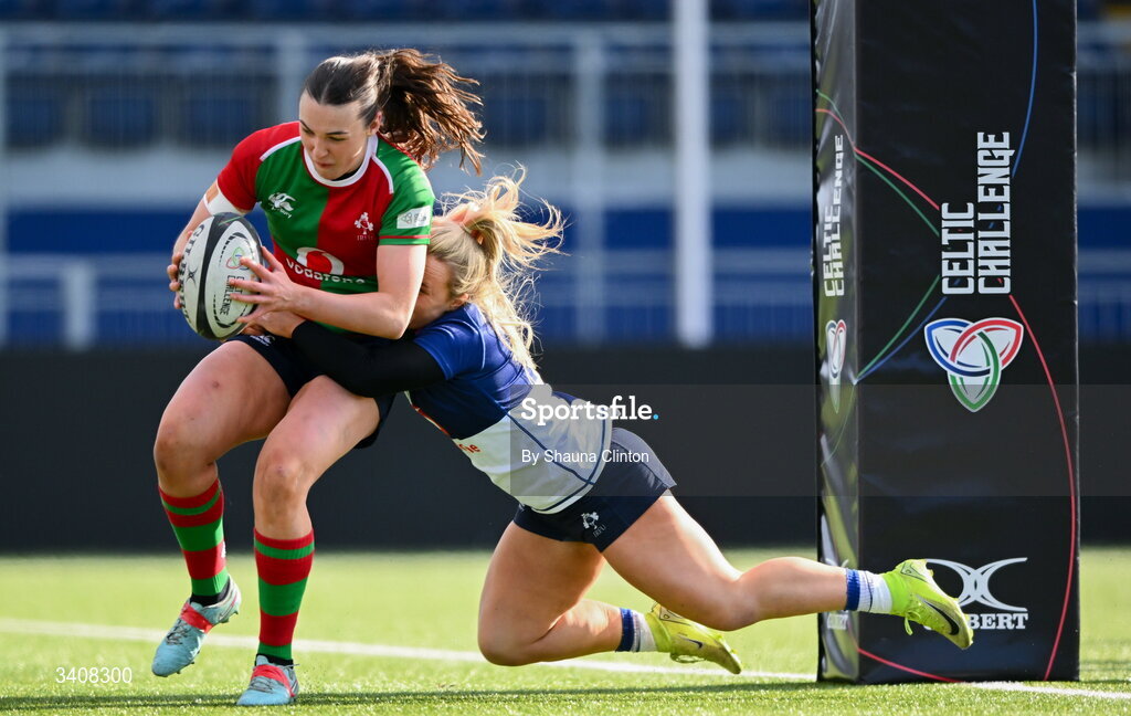 28 March 2026; Niamh Murphy of Clovers scores her side's first try despite the tackle of Aoife Dalton of Wolfhounds during the Celtic Challenge final match between Wolfhounds and Clovers at The Hive Stadium in Edinburgh, Scotland. Photo by Shauna Clinton/Sportsfile