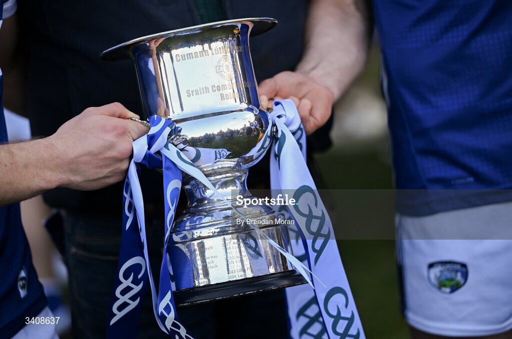 28 March 2026; Players pose with the Division 2 trophy with GAA ribbons after the Allianz Hurling League Division 2 final match between Laois and Kerry at Laois Hire O'Moore Park in Portlaoise, Laois. Photo by Brendan Moran/Sportsfile