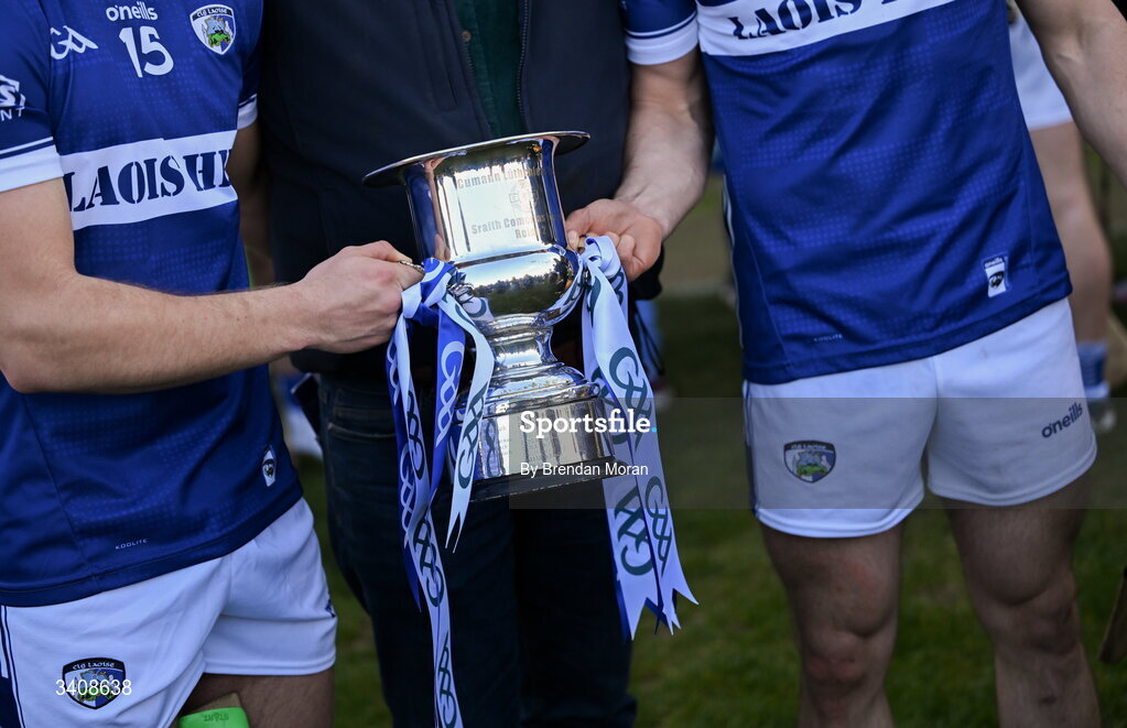 28 March 2026; Laois players pose with the Division 2 trophy with GAA ribbons after the Allianz Hurling League Division 2 final match between Laois and Kerry at Laois Hire O'Moore Park in Portlaoise, Laois. Photo by Brendan Moran/Sportsfile