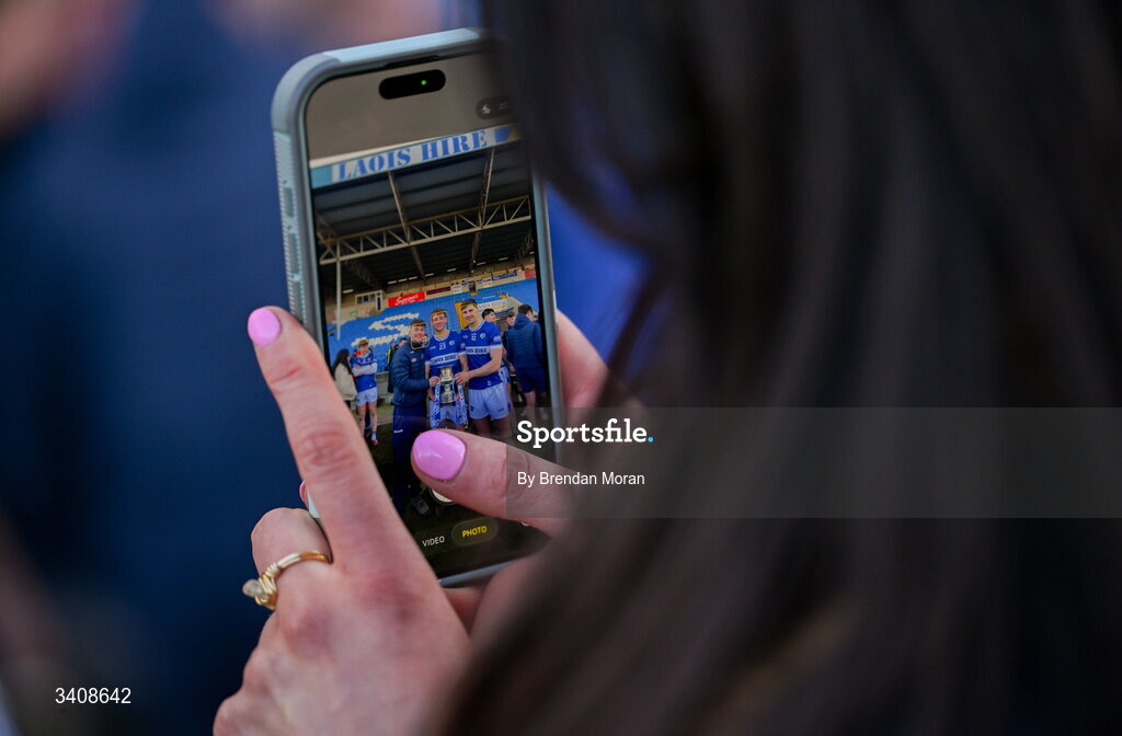28 March 2026; Laois players, from left, Jack Breen, Martin Phelan and Ryan Mullaney, all from Castletown, pose for a  photo with the trophy after the Allianz Hurling League Division 2 final match between Laois and Kerry at Laois Hire O'Moore Park in Portlaoise, Laois. Photo by Brendan Moran/Sportsfile