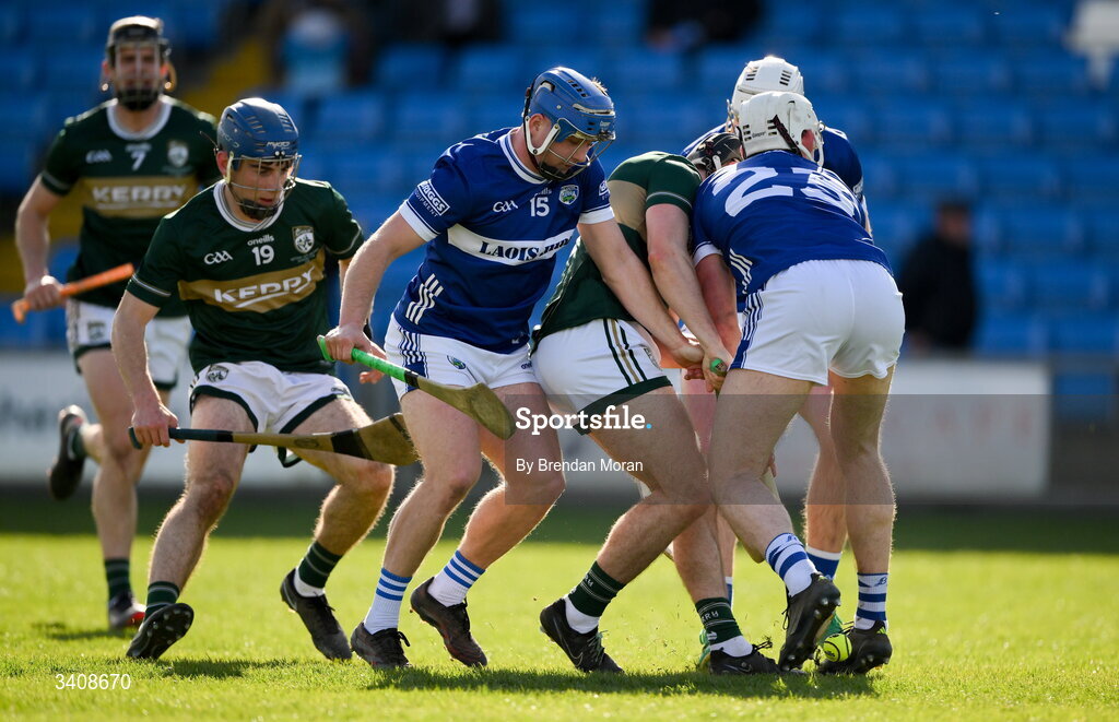 28 March 2026; Laois players Thomas Keyes, centre, and Martin Phelan contest possession with Kerry players Adam Segal and Sean McGrath during the Allianz Hurling League Division 2 final match between Laois and Kerry at Laois Hire O'Moore Park in Portlaoise, Laois. Photo by Brendan Moran/Sportsfile