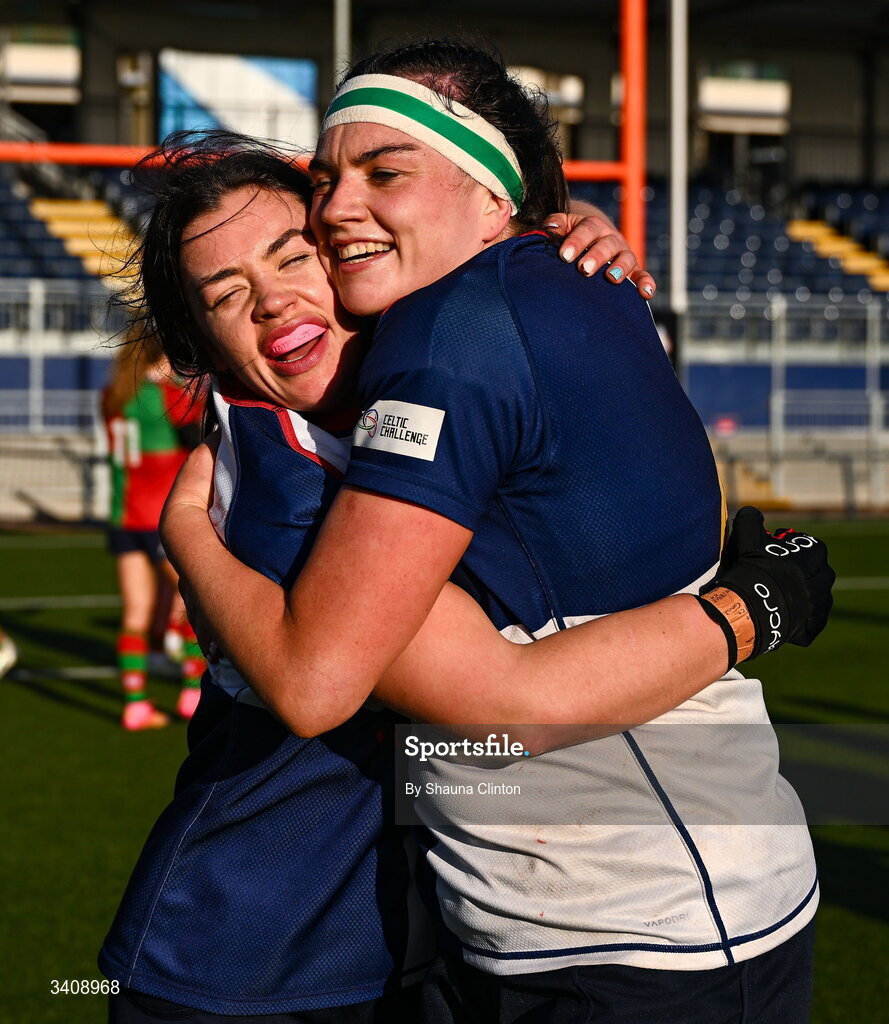 28 March 2026; Maeve Óg O'Leary, left, and Kate Jordan of Wolfhounds celebrate after their side's victory in the Celtic Challenge final match between Wolfhounds and Clovers at The Hive Stadium in Edinburgh, Scotland. Photo by Shauna Clinton/Sportsfile