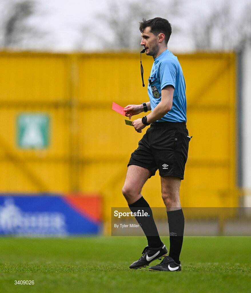 28 March 2026; Referee Ryan Maher shows a red card after a second yellow card to Freya De Mange of Wexford, not pictured, during the SSE Airtricity Women's Premier Division match between Galway United and Wexford at Eamonn Deacy Park in Galway. Photo by Tyler Miller/Sportsfile