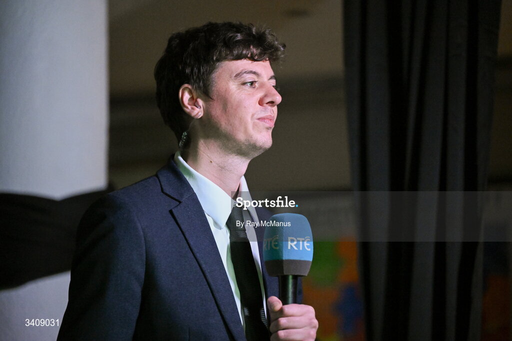 26 March 2026; RTÉ multimedia journalist Gavin O'Callaghan as Republic of Ireland supporters react while they watch the FIFA World Cup 2026 European Qualifiers play-off semi-final match between Czechia and Republic of Ireland at Fortuna Arena in Prague, Czechia, on a giant screen in O'Connell Secondary School, North Circular Road in Dublin. Photo by Ray McManus/Sportsfile