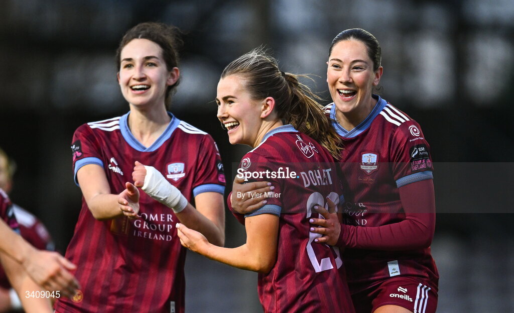 28 March 2026; Emma Doherty of Galway United, centre, celebrates with team-mates Isabella Beletic, left, and Aoibhin Donnelly after scoring their side's second goal during the SSE Airtricity Women's Premier Division match between Galway United and Wexford at Eamonn Deacy Park in Galway. Photo by Tyler Miller/Sportsfile