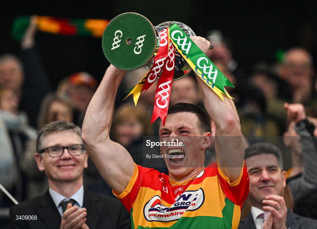 28 March 2026; Carlow captain Mikey Bambrick lifts the cup after the Allianz Football League Division 4 final match between Carlow and Longford at Croke Park in Dublin. Photo by David Fitzgerald/Sportsfile