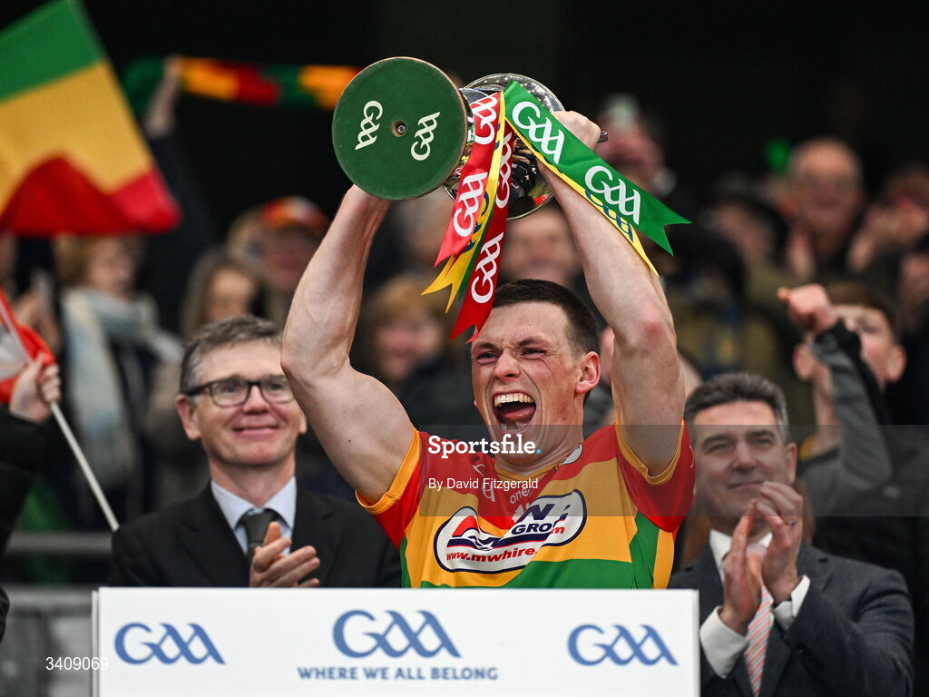28 March 2026; Carlow captain Mikey Bambrick lifts the cup after the Allianz Football League Division 4 final match between Carlow and Longford at Croke Park in Dublin. Photo by David Fitzgerald/Sportsfile