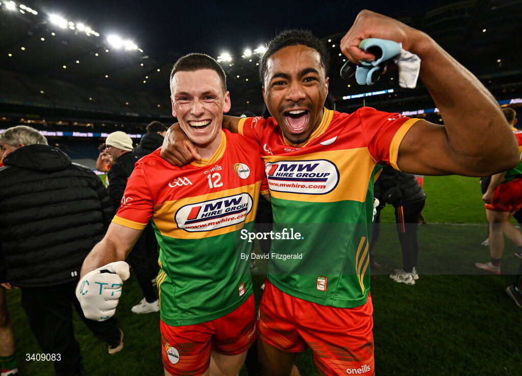 28 March 2026; Mikey Bambrick, left, and John Phiri of Carlow celebrate after the Allianz Football League Division 4 final match between Carlow and Longford at Croke Park in Dublin. Photo by David Fitzgerald/Sportsfile