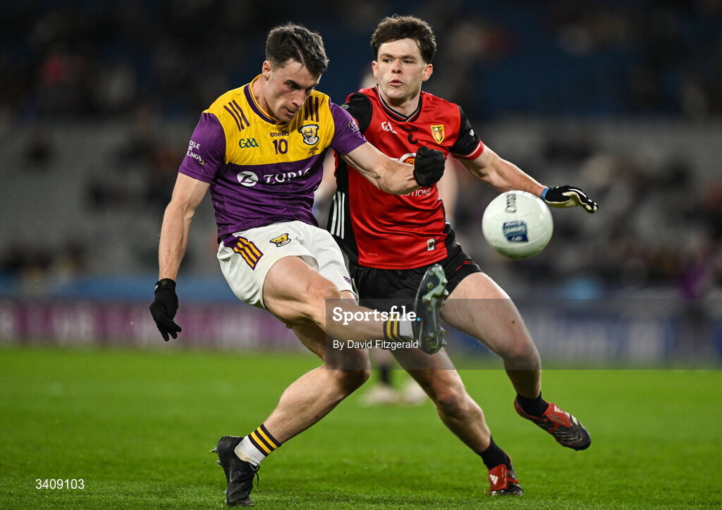 28 March 2026; Páiric Hughes of Wexford in action against Shane Annett of Down during the Allianz Football League Division 3 final match between Down and Wexford at Croke Park in Dublin. Photo by David Fitzgerald/Sportsfile