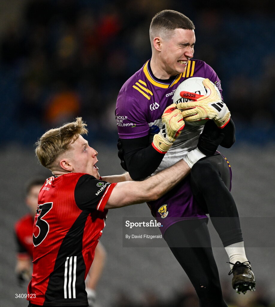 28 March 2026; Wexford goalkeeper Darragh Brooks in action against Adam Crimmins of Down during the Allianz Football League Division 3 final match between Down and Wexford at Croke Park in Dublin. Photo by David Fitzgerald/Sportsfile