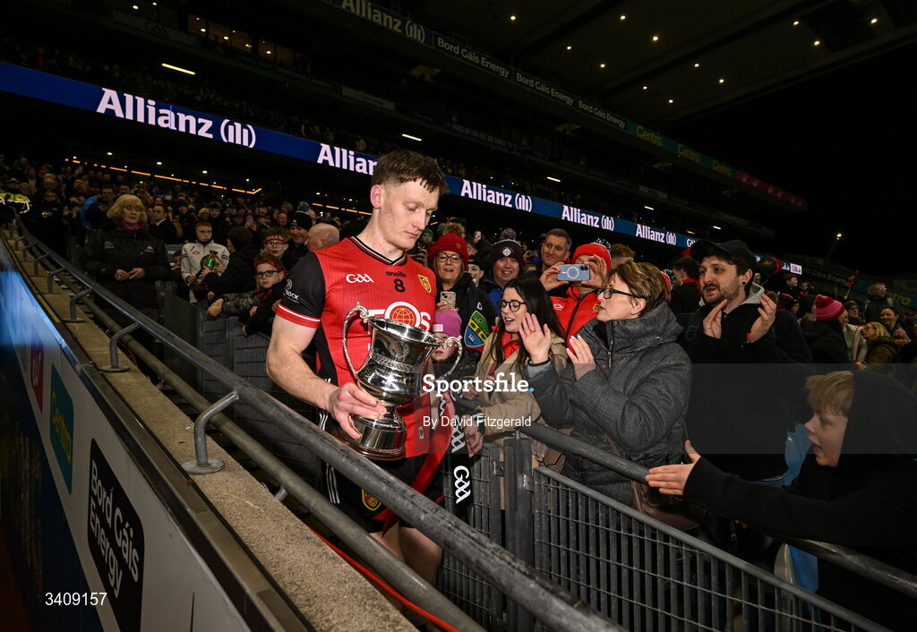 28 March 2026; Down captain Odhran Murdock walks down the Hogan stand stairs with the cup after the Allianz Football League Division 3 final match between Down and Wexford at Croke Park in Dublin. Photo by David Fitzgerald/Sportsfile