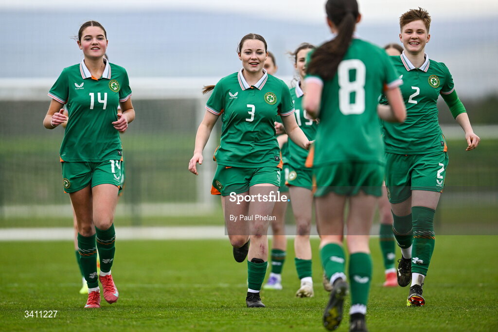 31 March 2026; Ava Hallinan, Keelin Donnelly Meehan and Leah O'Leary Callendar of Republic of Ireland run to congratulate Ellen Goggin for scoring the winning penalty in the penalty shoot-out after the Girls U16 international friendly match ended 1-1 between Repubic of Ireland and Switzerland at the FAI National Training Centre in Abbotstown, Dublin. Photo by Paul Phelan/Sportsfile
