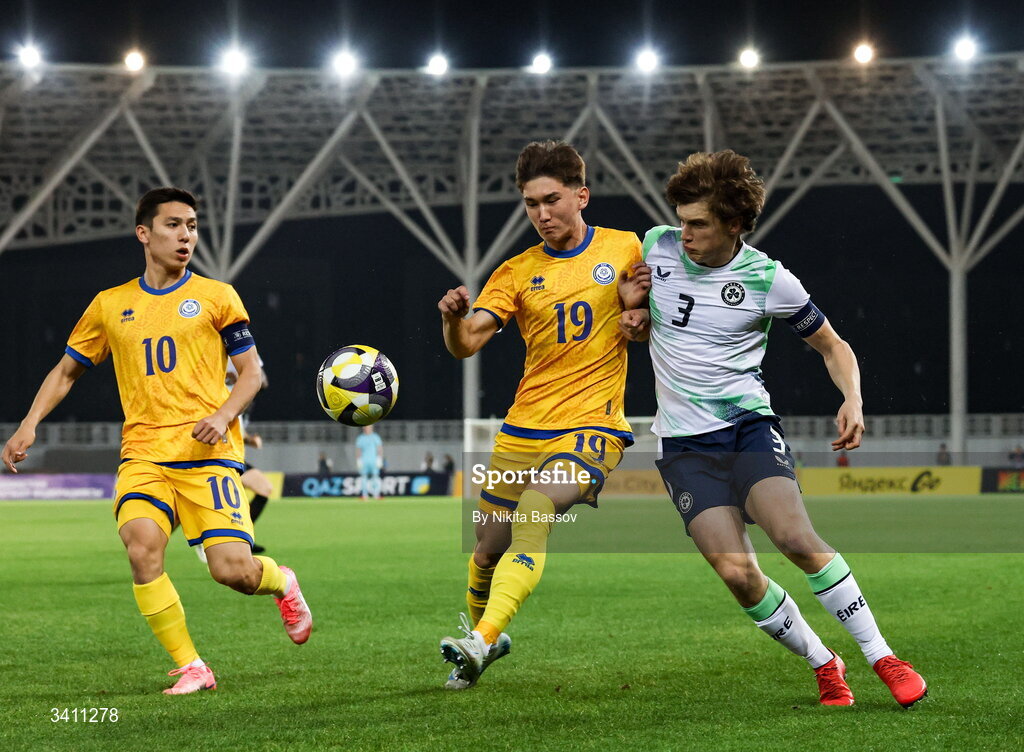 31 March 2026; Tamerlan Agimanov, centre, and Abinur Nurymbet of Kazakhstan in action against Conor McManus of Republic of Ireland during the UEFA European U21 Championship qualifier match between Kazakhstan and Republic of Ireland at Turkistan Arena in Turkeistan, Kazakhstan. Photo by Nikita Bassov/Sportsfile