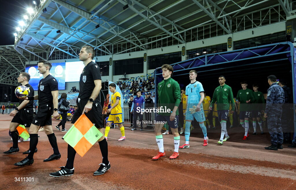 31 March 2026; Republic of Ireland captain Conor McManus, centre, leads his side out before the UEFA European U21 Championship qualifier match between Kazakhstan and Republic of Ireland at Turkistan Arena in Turkeistan, Kazakhstan. Photo by Nikita Bassov/Sportsfile
