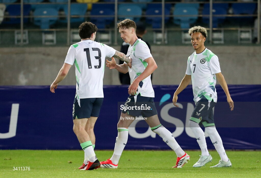 31 March 2026; Oisin Gallagher of Republic of Ireland, centre, celebrates with teammates Sean Patton, right, and Trent Kone-Doherty after scoring his side's first goal during the UEFA European U21 Championship qualifier match between Kazakhstan and Republic of Ireland at Turkistan Arena in Turkeistan, Kazakhstan. Photo by Nikita Bassov/Sportsfile