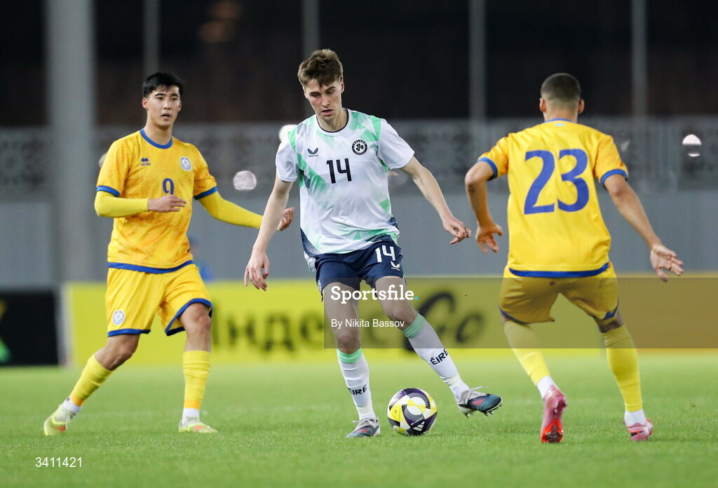 31 March 2026; Cathal McCarthy of Republic of Ireland in action against Saif Popov, right, and Ramazan Bagdat of Kazakhstan during the UEFA European U21 Championship qualifier match between Kazakhstan and Republic of Ireland at Turkistan Arena in Turkeistan, Kazakhstan. Photo by Nikita Bassov/Sportsfile