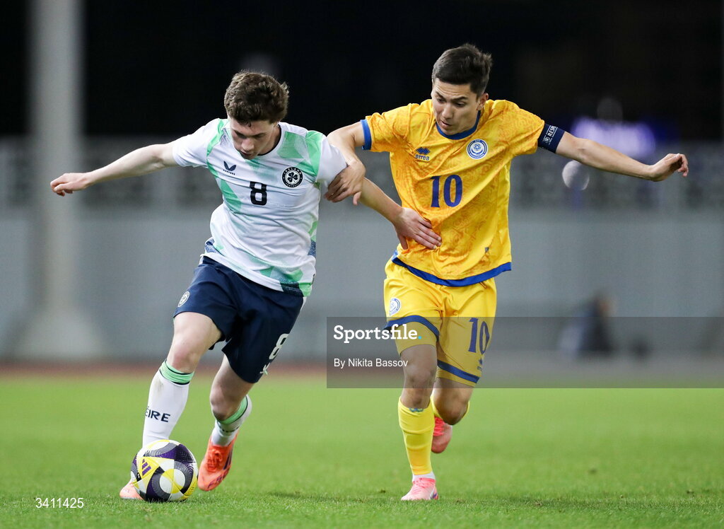 31 March 2026; Jamie Mullins of Republic of Ireland in action against Abinur Nurymbet of Kazakhstan during the UEFA European U21 Championship qualifier match between Kazakhstan and Republic of Ireland at Turkistan Arena in Turkeistan, Kazakhstan. Photo by Nikita Bassov/Sportsfile