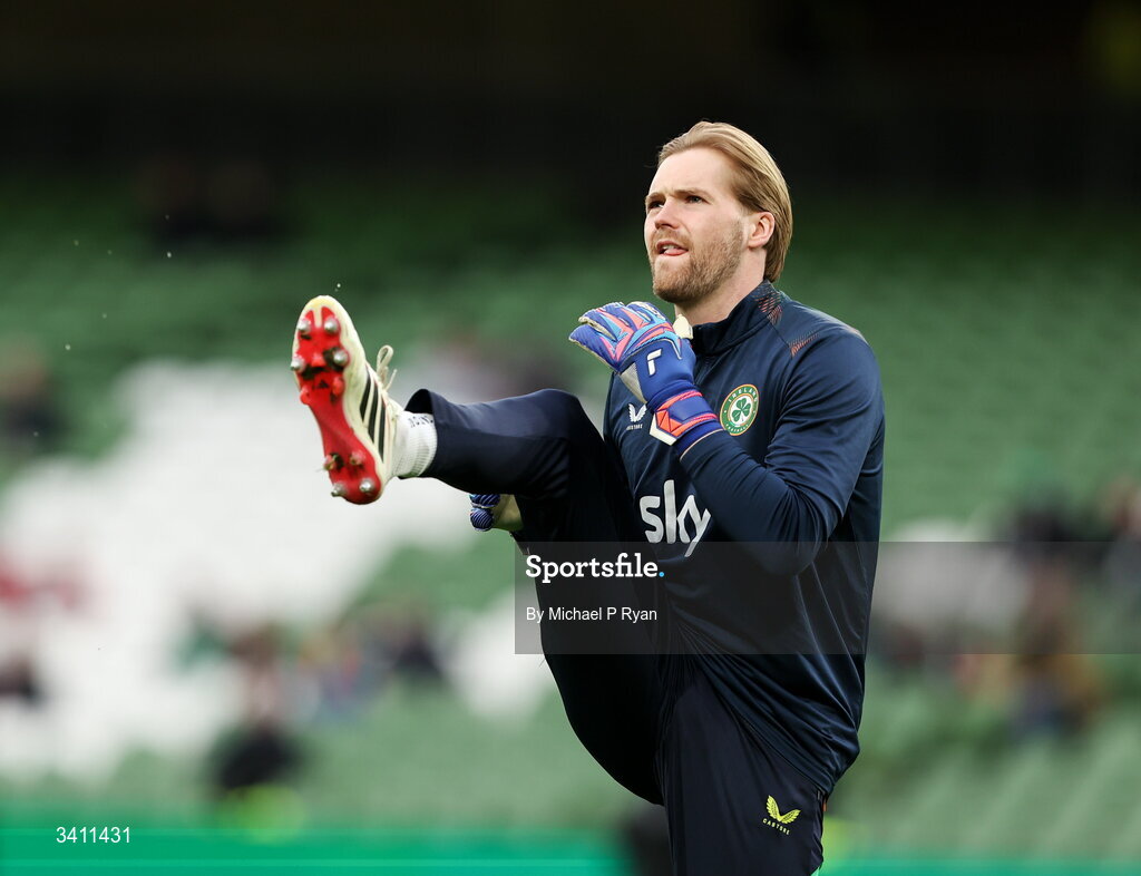 31 March 2026; Republic of Ireland goalkeeper Caoimhin Kelleher warms up before the international friendly match between Republic of Ireland and North Macedonia at Aviva Stadium in Dublin. Photo by Michael P Ryan/Sportsfile