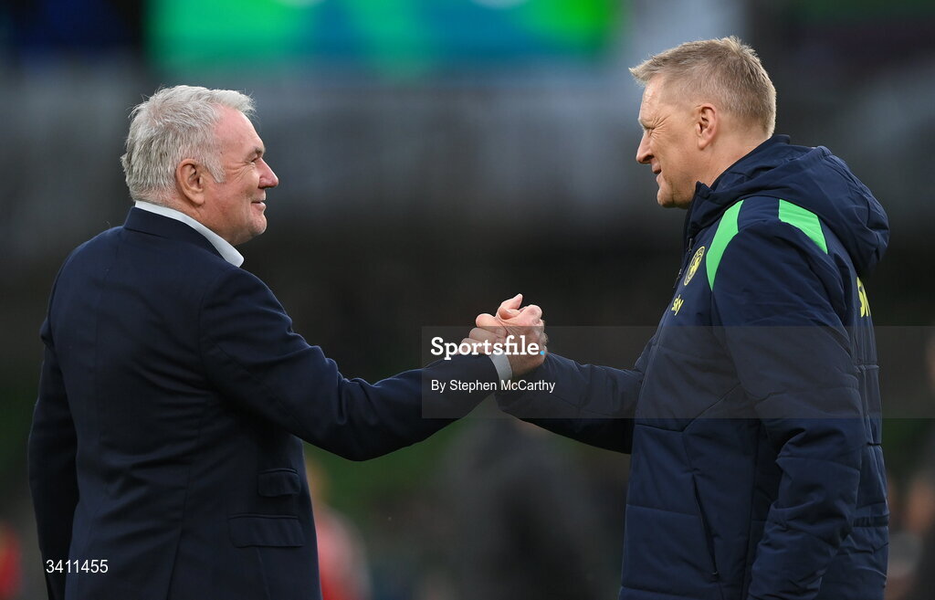 31 March 2026; Former Republic of Ireland player and current RTÉ soccer analyst Ray Houghton, left, and Republic of Ireland head coach Heimir Hallgrimsson meet before the international friendly match between Republic of Ireland and North Macedonia at Aviva Stadium in Dublin. Photo by Stephen McCarthy/Sportsfile