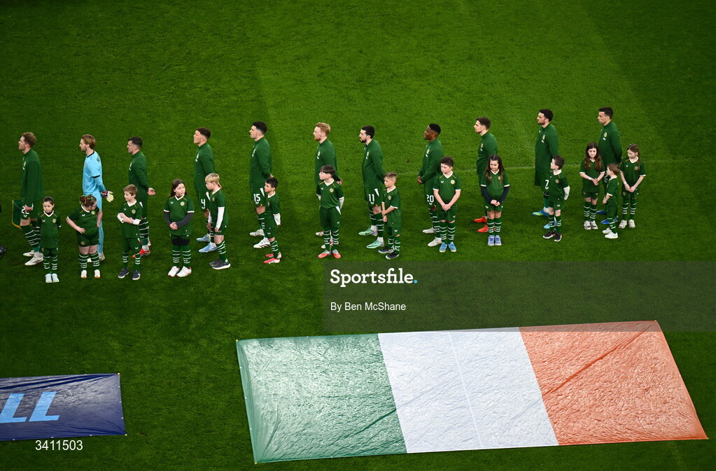 31 March 2026; The Republic of Ireland team stand for Amhrán na bhFiann before the international friendly match between Republic of Ireland and North Macedonia at Aviva Stadium in Dublin. Photo by Ben McShane/Sportsfile