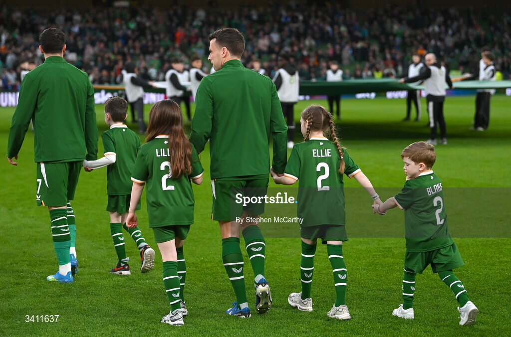 31 March 2026; Seamus Coleman of Republic of Ireland makes his way onto the pitch with his children Lily, Ellie and Blake before the international friendly match between Republic of Ireland and North Macedonia at Aviva Stadium in Dublin. Photo by Stephen McCarthy/Sportsfile