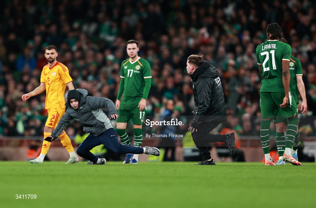 31 March 2026; A pitch invader runs on the pitch during the international friendly match between Republic of Ireland and North Macedonia at Aviva Stadium in Dublin. Photo by Thomas Flinkow/Sportsfile
