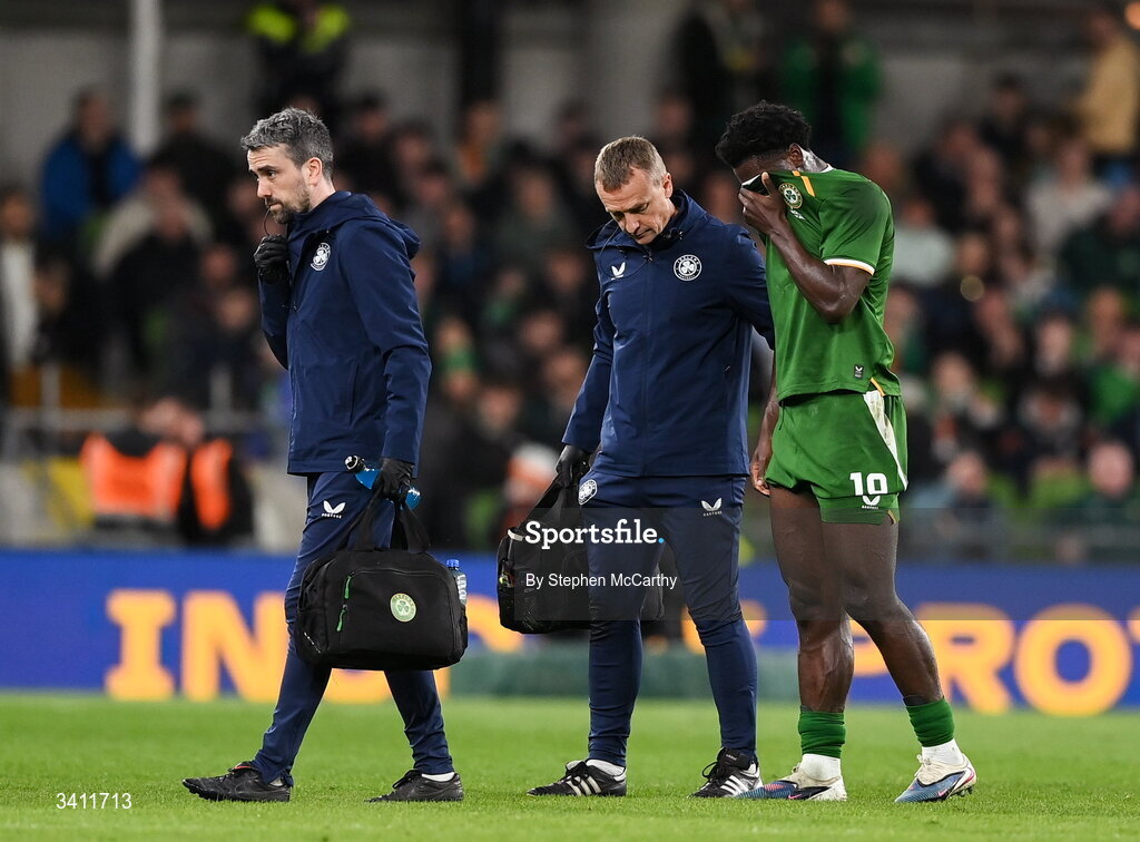 31 March 2026; James Abankwah of Republic of Ireland leaves the pitch with an injury, accompanied by lead physiotherapist Danny Miller and team doctor Sean Carmody, left, during the international friendly match between Republic of Ireland and North Macedonia at Aviva Stadium in Dublin. Photo by Stephen McCarthy/Sportsfile
