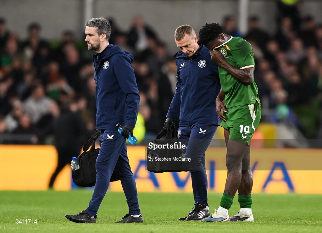 31 March 2026; James Abankwah of Republic of Ireland leaves the pitch with an injury, accompanied by lead physiotherapist Danny Miller and team doctor Sean Carmody, left, during the international friendly match between Republic of Ireland and North Macedonia at Aviva Stadium in Dublin. Photo by Stephen McCarthy/Sportsfile