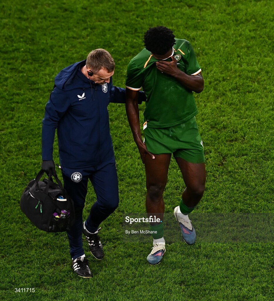 31 March 2026; James Abankwah of Republic of Ireland leaves the pitch with an injury, accompanied by lead physiotherapist Danny Miller during the international friendly match between Republic of Ireland and North Macedonia at Aviva Stadium in Dublin. Photo by Ben McShane/Sportsfile