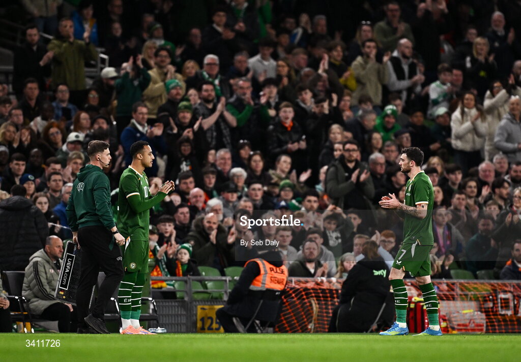31 March 2026; Adam Idah of Republic of Ireland, left, comes onto the pitch as a substitute for teammate Troy Parrott, right, during the international friendly match between Republic of Ireland and North Macedonia at the Aviva Stadium in Dublin. Photo by Seb Daly/Sportsfile