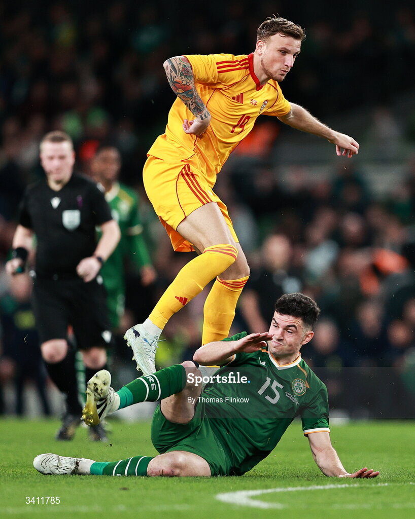 31 March 2026; John Egan of Republic of Ireland in action against Milan Ristovski of North Macedonia during the international friendly match between Republic of Ireland and North Macedonia at Aviva Stadium in Dublin. Photo by Thomas Flinkow/Sportsfile