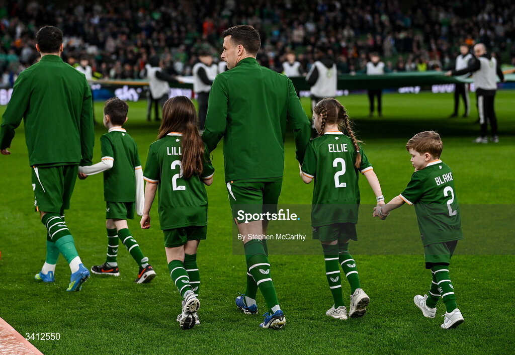 31 March 2026; Seamus Coleman of Republic of Ireland makes his way onto the pitch with his children Lily, Ellie and Blake before the international friendly match between Republic of Ireland and North Macedonia at Aviva Stadium in Dublin.  Photo by Stephen McCarthy/Sportsfile