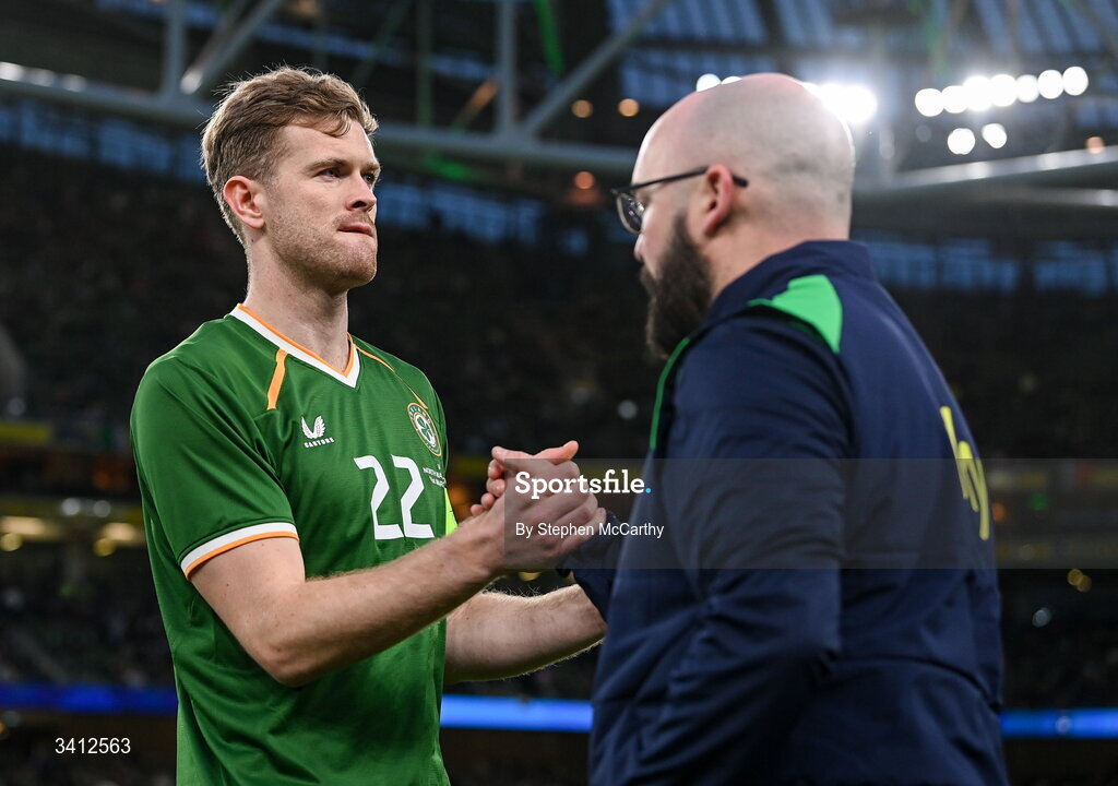 31 March 2026; Republic of Ireland captain Nathan Collins and kit and equipment manager Karl McKenna before the international friendly match between Republic of Ireland and North Macedonia at Aviva Stadium in Dublin. Photo by Stephen McCarthy/Sportsfile