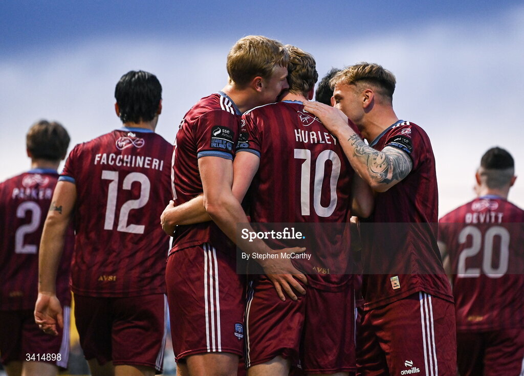 3 April 2026; David Hurley is congratulated by Galway United team-mates Kris Twardek, left, and Stephen Walsh after scoring his side's first goal during the SSE Airtricity Men's Premier Division match between Galway United and Derry City at Eamonn Deacy Park in Galway. Photo by Stephen McCarthy/Sportsfile