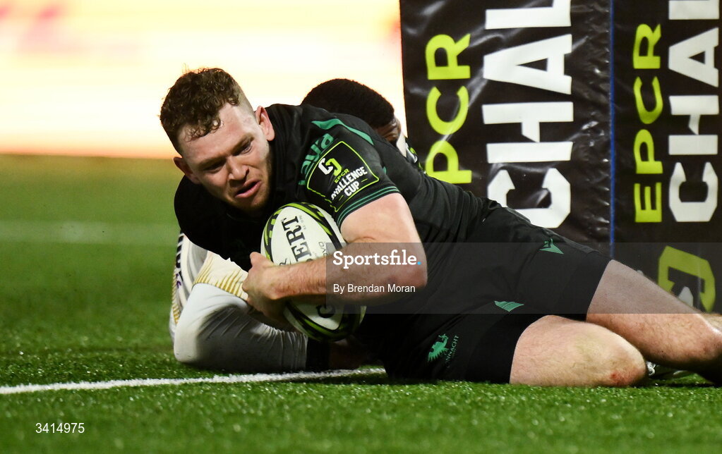 3 April 2026; Cathal Forde of Connacht scores his side's fourth try despite the tackle of Hakeem Kunene of Hollywoodbets Sharks during the EPCR Challenge Cup match between Connacht and Hollywoodbets Sharks at Dexcom Stadium in Galway. Photo by Brendan Moran/Sportsfile