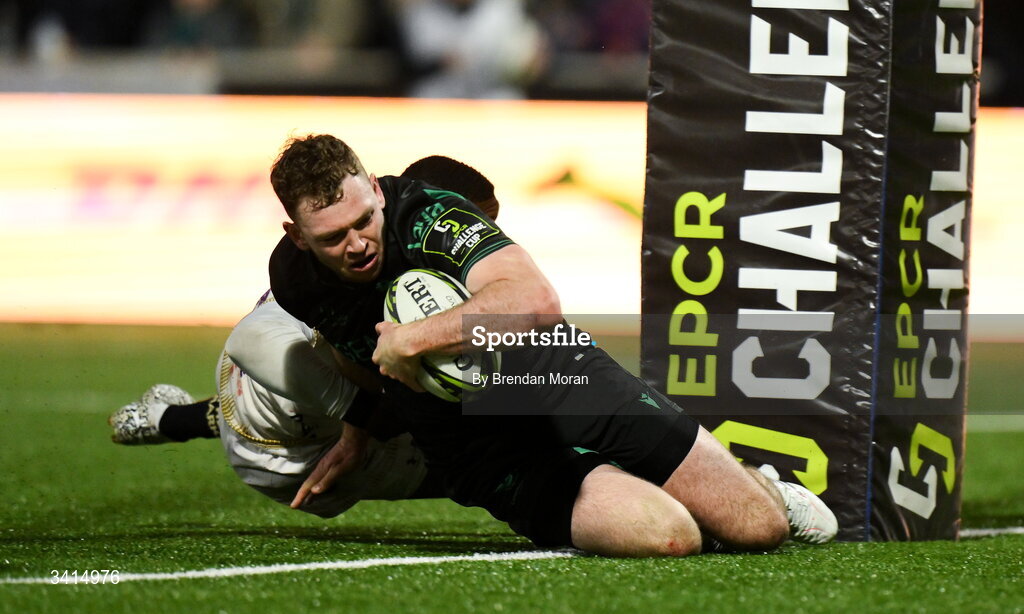 3 April 2026; Cathal Forde of Connacht scores his side's fourth try despite the tackle of Hakeem Kunene of Hollywoodbets Sharks during the EPCR Challenge Cup match between Connacht and Hollywoodbets Sharks at Dexcom Stadium in Galway. Photo by Brendan Moran/Sportsfile
