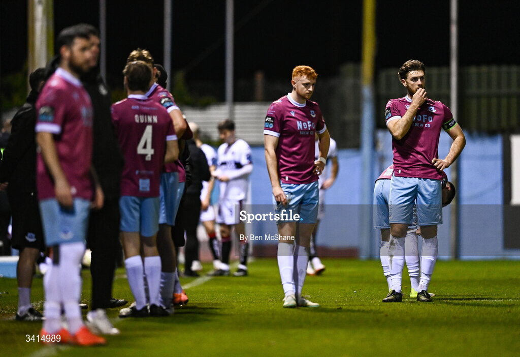3 April 2026; Drogheda United players, including Conor Keeley, right, and James Bolger look on concerned about the well-being of teammate Shane Farrell, as he receives medical attention, during the SSE Airtricity Men's Premier Division match between Drogheda United and Bohemians at Sullivan & Lambe Park in Drogheda, Louth. Photo by Ben McShane/Sportsfile