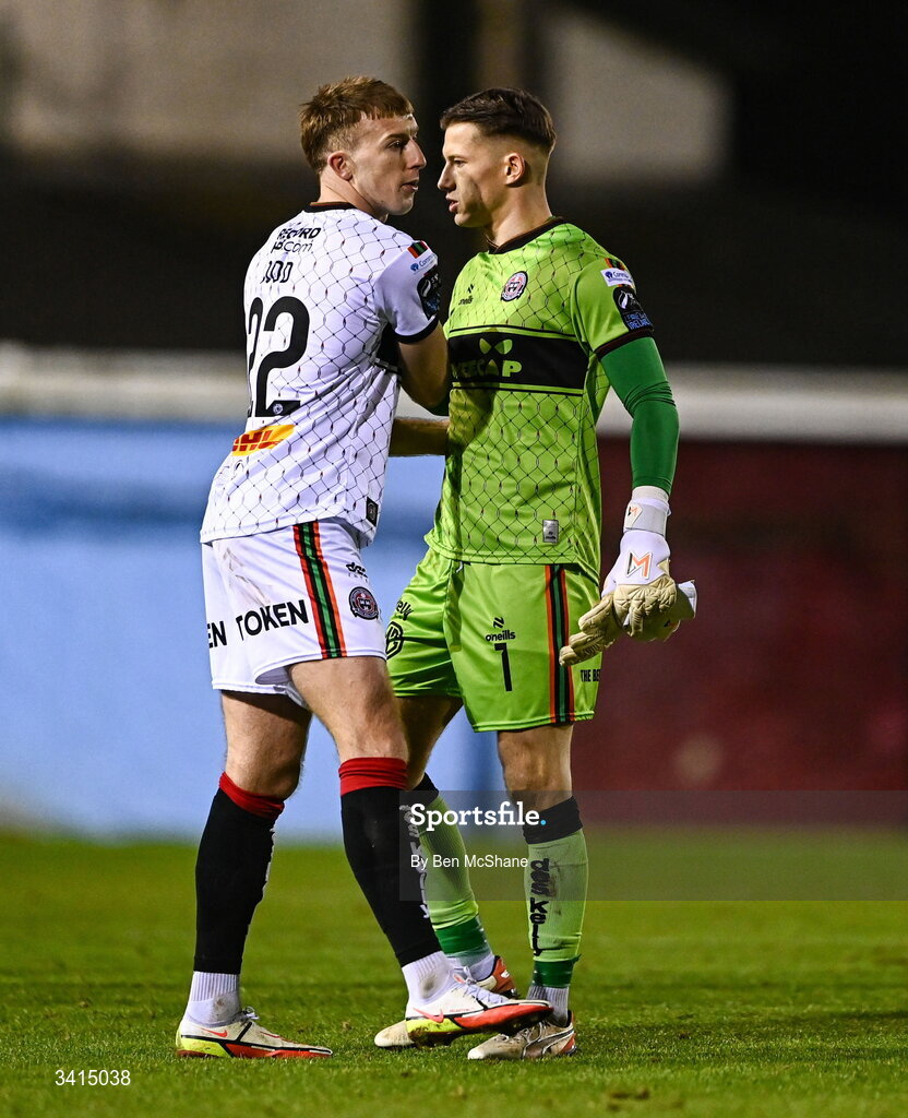 3 April 2026; Sam Todd, left, and Bohemians goalkeeper Kacper Chorazka after the SSE Airtricity Men's Premier Division match between Drogheda United and Bohemians at Sullivan & Lambe Park in Drogheda, Louth. Photo by Ben McShane/Sportsfile
