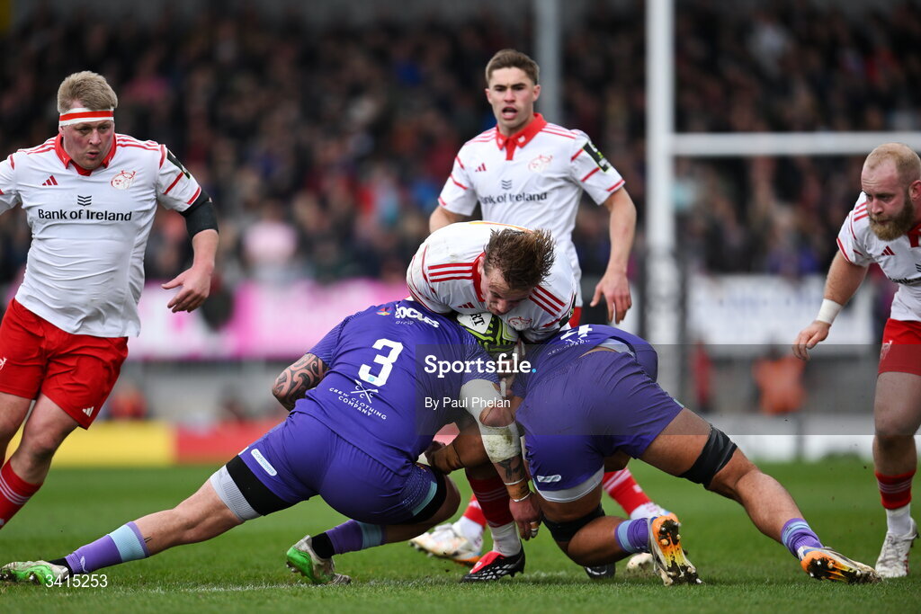4 April 2026; Gavin Coombes of Munster is tackled by Jimmy Roots, left, and Dafydd Jenkins of Exeter Chiefs during the EPCR Challenge Cup match between Exeter Chiefs and Munster at Sandy Park in Exeter, England. Photo by Paul Phelan/Sportsfile