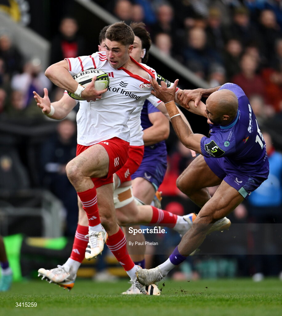4 April 2026; Jack Crowley of Munster is tackled by Olly Woodburn of Exeter Chiefs during the EPCR Challenge Cup match between Exeter Chiefs and Munster at Sandy Park in Exeter, England. Photo by Paul Phelan/Sportsfile