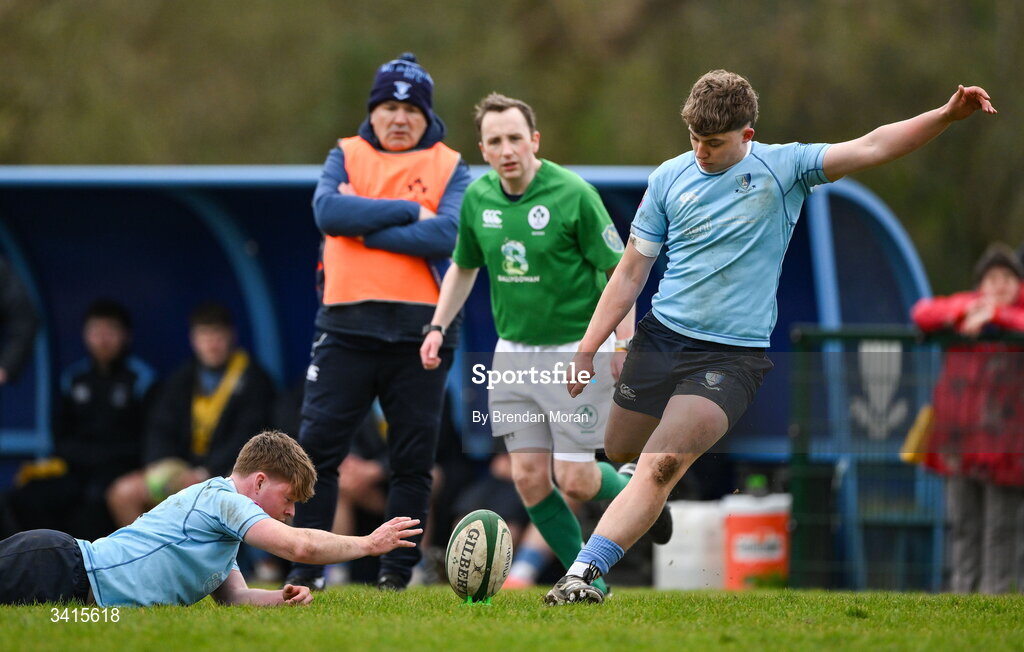 4 April 2026; Oisin O'Neill of MU Barnhall kicks with the assistance of teammate Adam Gray during the Energia Men's All-Ireland League Division match between MU Barnhall and Wanderers RFC at MU Barnhall RFC in Parsonstown, Kildare. Photo by Brendan Moran/Sportsfile