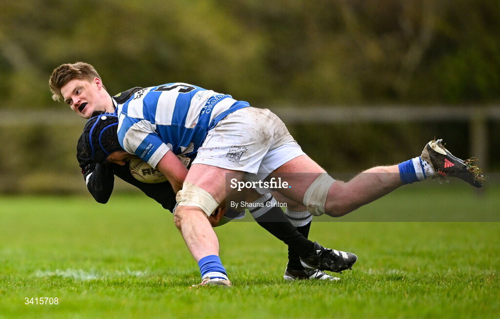 4 April 2026; David Connolly of Longford RFC is tackled by Tom Brady of Athy RFC during the Bank of Ireland Provincial Towns Cup semi-final match between Athy RFC and Longford RFC at Cill Dara RFC in Silken Thomas Park in Kildare. Photo by Shauna Clinton/Sportsfile