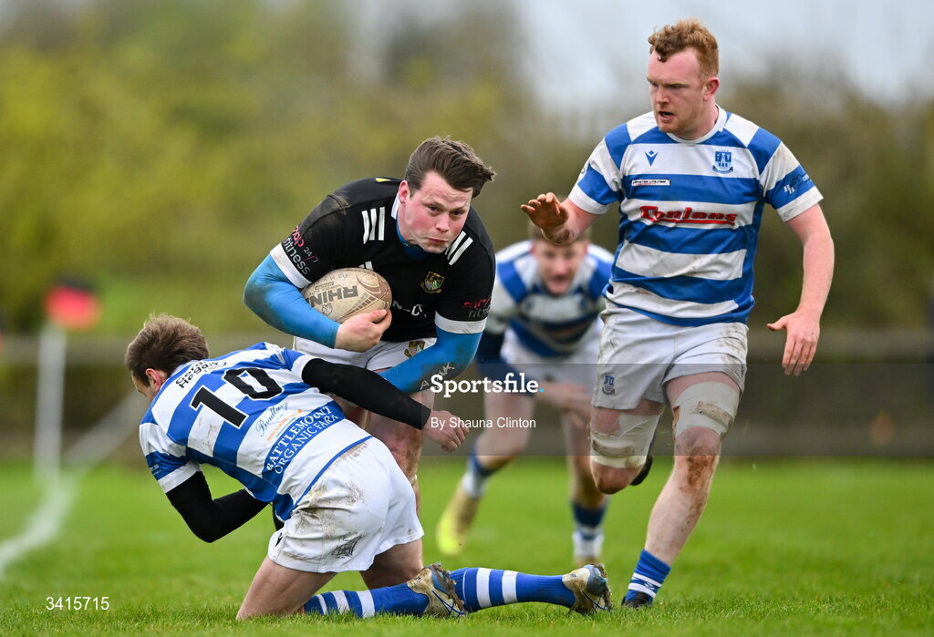4 April 2026; Ryan McHugh of Longford RFC is tackled by Craig Millar of Athy RFC during the Bank of Ireland Provincial Towns Cup semi-final match between Athy RFC and Longford RFC at Cill Dara RFC in Silken Thomas Park in Kildare. Photo by Shauna Clinton/Sportsfile