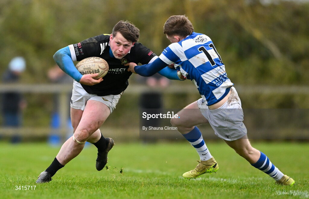 4 April 2026; Ryan McHugh of Longford RFC is tackled by Ciarán Fennessy of Athy RFC during the Bank of Ireland Provincial Towns Cup semi-final match between Athy RFC and Longford RFC at Cill Dara RFC in Silken Thomas Park in Kildare. Photo by Shauna Clinton/Sportsfile