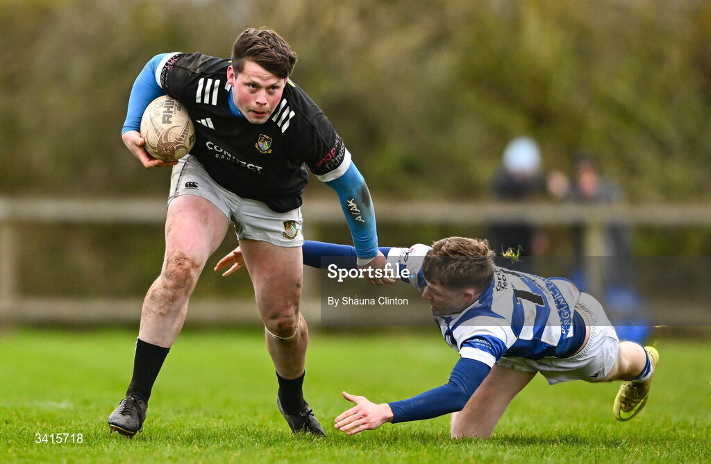 4 April 2026; Ryan McHugh of Longford RFC is tackled by Ciarán Fennessy of Athy RFC during the Bank of Ireland Provincial Towns Cup semi-final match between Athy RFC and Longford RFC at Cill Dara RFC in Silken Thomas Park in Kildare. Photo by Shauna Clinton/Sportsfile