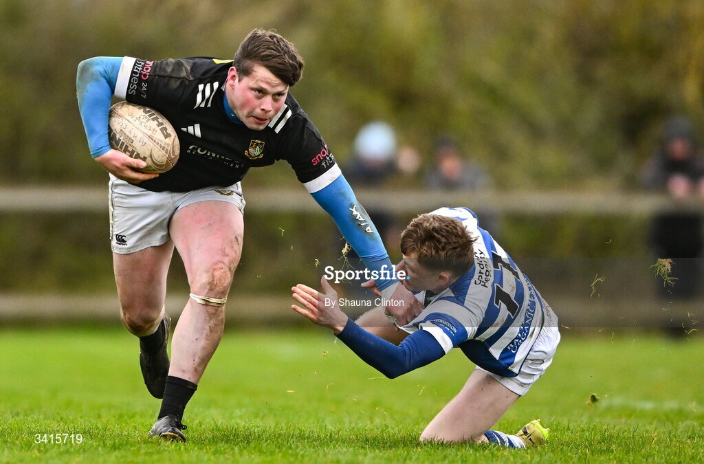 4 April 2026; Ryan McHugh of Longford RFC is tackled by Ciarán Fennessy of Athy RFC during the Bank of Ireland Provincial Towns Cup semi-final match between Athy RFC and Longford RFC at Cill Dara RFC in Silken Thomas Park in Kildare. Photo by Shauna Clinton/Sportsfile